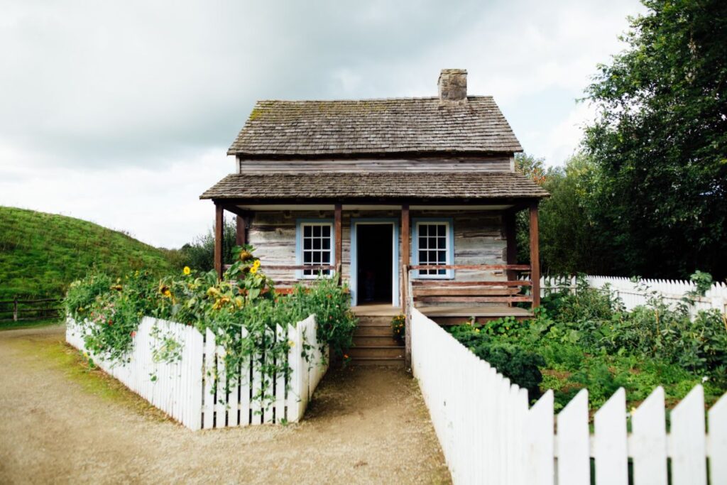 Mini House With White Fence