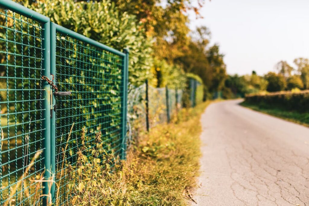 Closeup Image on a Metallic Fence beside the Road